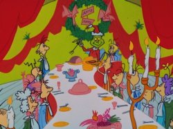 Picture of the grinch and who's from whoville eating Christmas supper.
